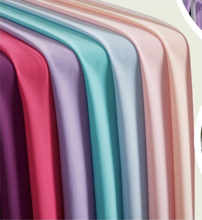 Drape fabrics in plum, pink, lavender, turquoise, light blue, blush, peach, and ivory